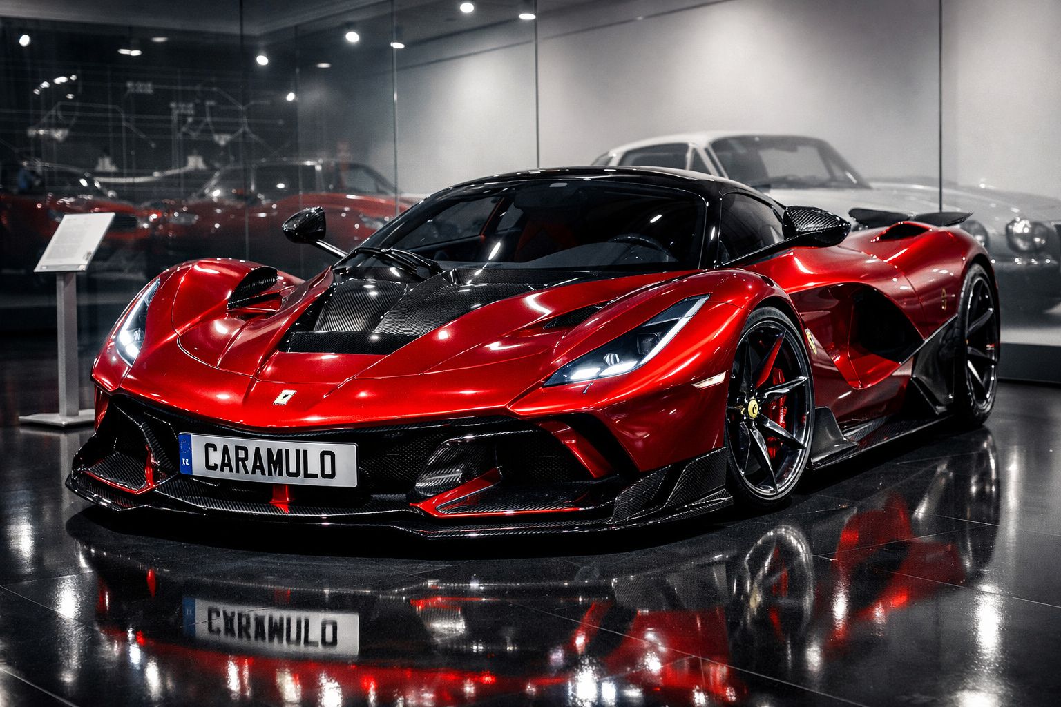 Carro desportivo vermelho com detalhes em carbono exposto numa sala de museu, placa com "Caramulo".